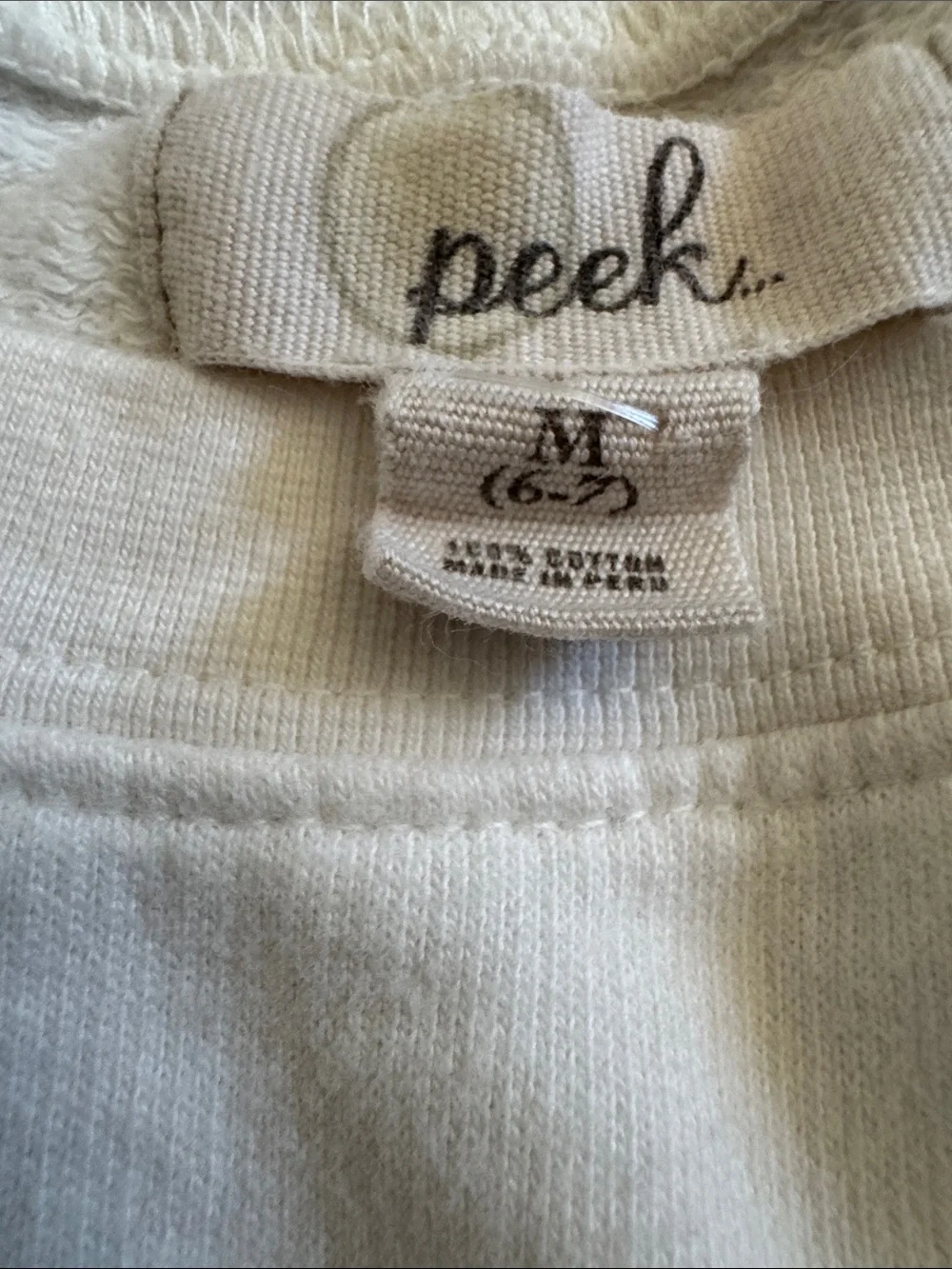 Peek White Sweatshirt with Pink-to-Green Rainbow Dog